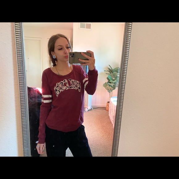 Maroon and white volcom sweater.